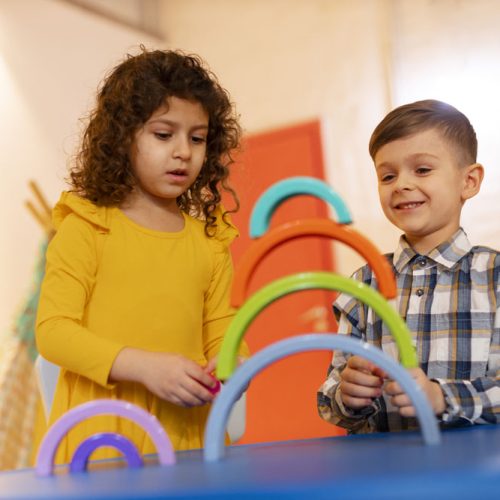 young-boy-girl-playing-indoors-with-eco-toys